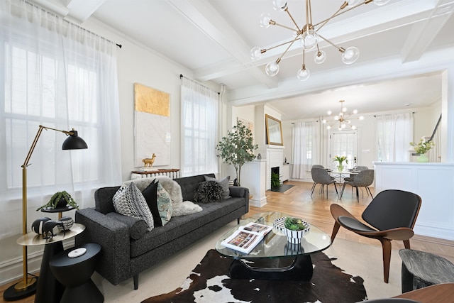 372 Webster Ave, Jersey City, NJ 07307 - living area featuring a chandelier, beam ceiling, healthy amount of natural light, wood finished floors, and crown molding