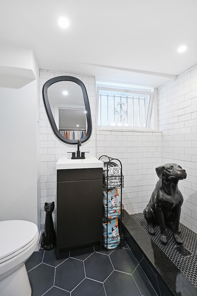 372 Webster Ave, Jersey City, NJ 07307 - bathroom featuring tile patterned floors, tile walls, vanity, and recessed lighting