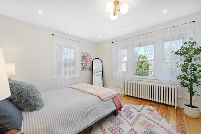 372 Webster Ave, Jersey City, NJ 07307 - bedroom with radiator heating unit, wood finished floors, and recessed lighting
