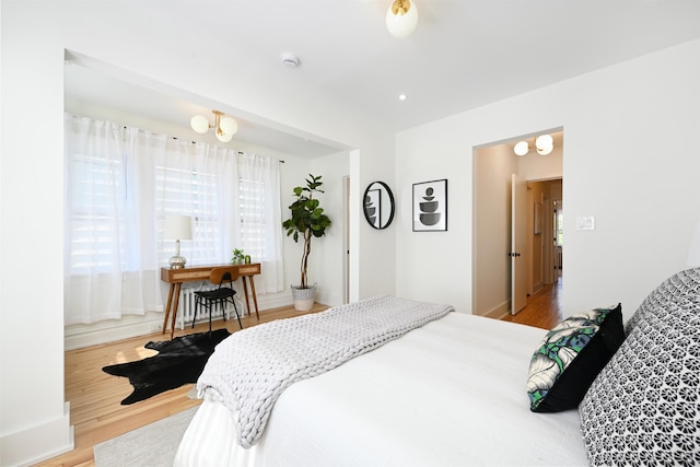 372 Webster Ave, Jersey City, NJ 07307 - bedroom with wood finished floors and a chandelier