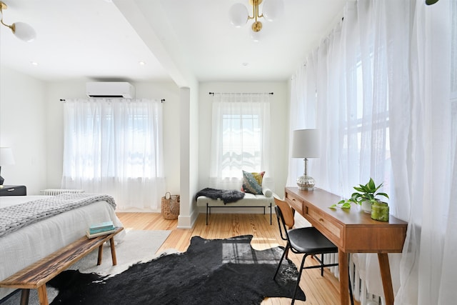 372 Webster Ave, Jersey City, NJ 07307 - bedroom with a wall mounted air conditioner and wood finished floors