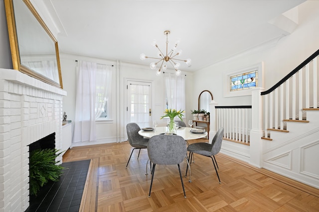 372 Webster Ave, Jersey City, NJ 07307 - dining room featuring a chandelier, plenty of natural light, a fireplace, stairway, and crown molding