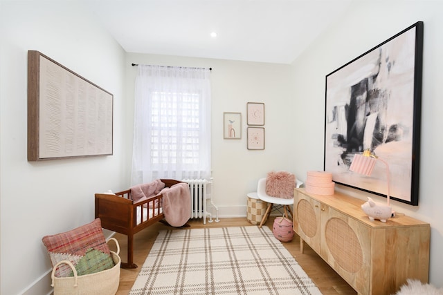 372 Webster Ave, Jersey City, NJ 07307 - bedroom featuring radiator, wood finished floors, and recessed lighting