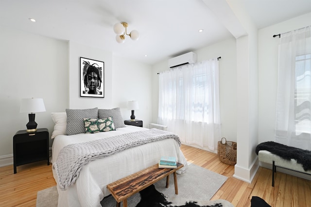 372 Webster Ave, Jersey City, NJ 07307 - bedroom featuring a wall mounted AC and light wood-style floors