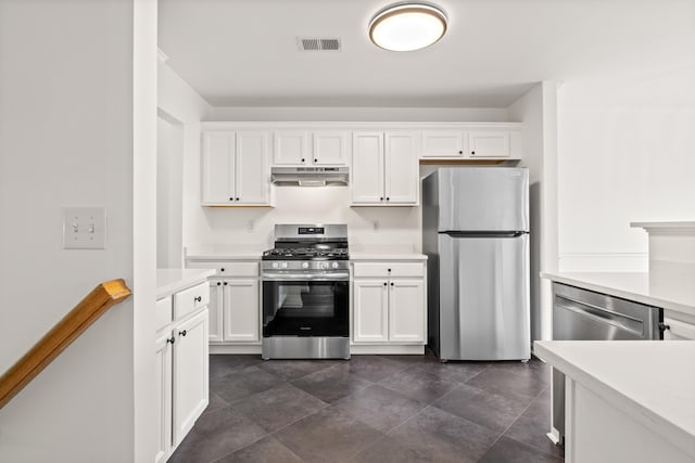 kitchen featuring visible vents, light countertops, under cabinet range hood, and appliances with stainless steel finishes