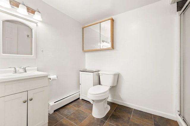 bathroom with vanity, a baseboard radiator, and toilet