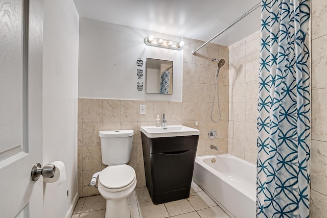 full bathroom featuring toilet, tile walls, tile patterned flooring, vanity, and shower / tub combo with curtain