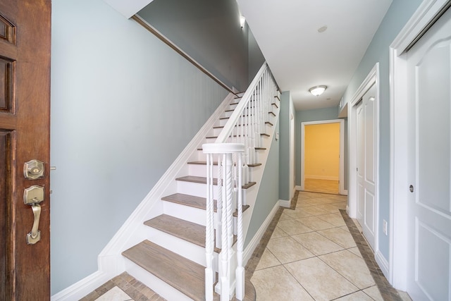 9033 Wall St Unit 2, North Bergen, NJ 07047 - stairs with baseboards and tile patterned floors