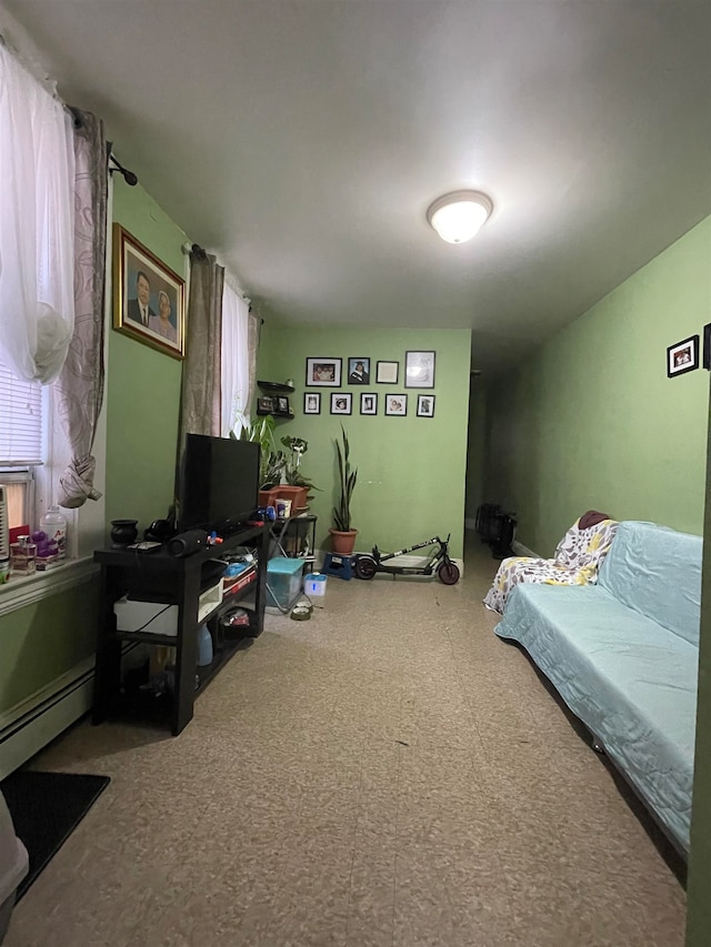 bedroom with a baseboard heating unit