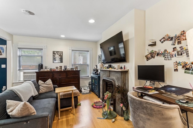 living room featuring light hardwood / wood-style flooring and cooling unit