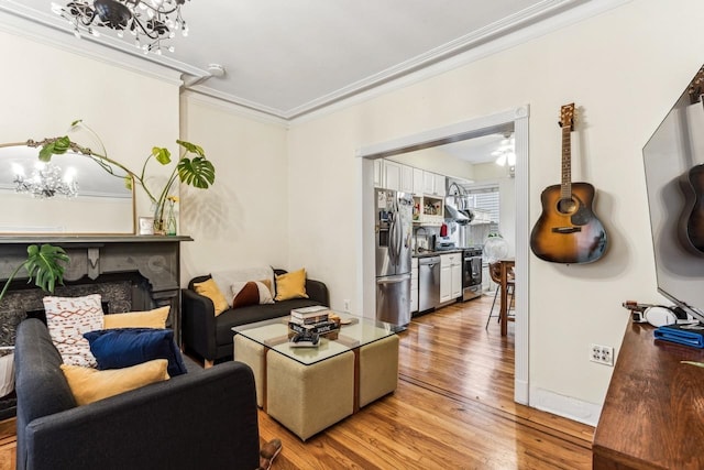 living room with hardwood / wood-style flooring and ornamental molding