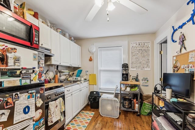 kitchen featuring ventilation hood, stainless steel appliances, white cabinetry, light hardwood / wood-style floors, and ceiling fan