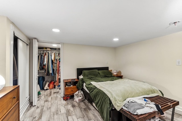 bedroom featuring a closet and light hardwood / wood-style flooring