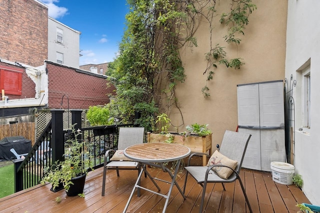 wooden deck with grilling area