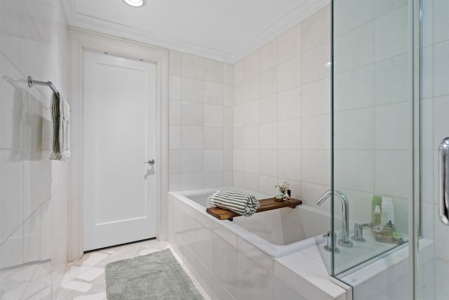 bathroom featuring tile walls, a bath, and ornamental molding