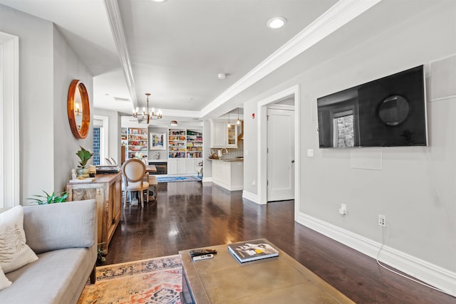 living area with visible vents, baseboards, dark wood-style flooring, and an inviting chandelier