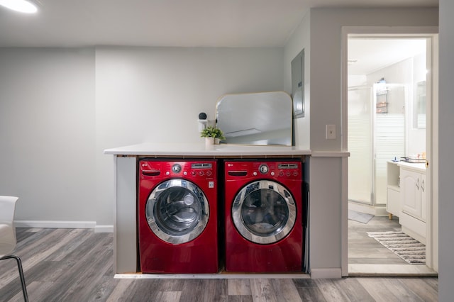 1406 8th St Unit 9, North Bergen, NJ 07047 - laundry room with washing machine and dryer, wood finished floors, and baseboards