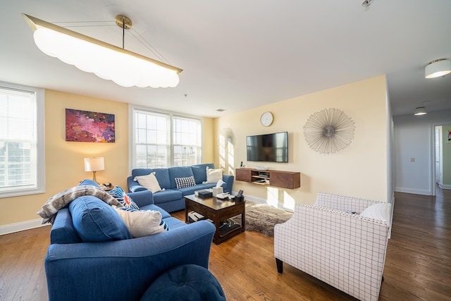 living room featuring wood finished floors and baseboards