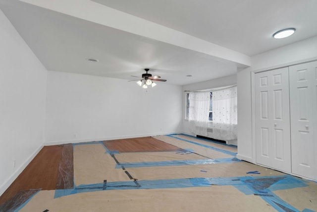 interior space with ceiling fan and hardwood / wood-style floors