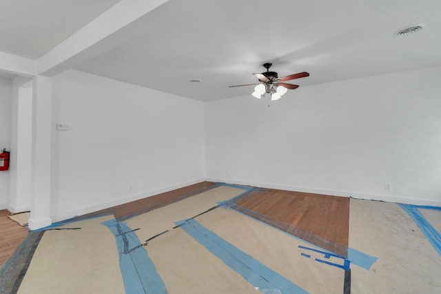 interior space featuring ceiling fan and basketball hoop