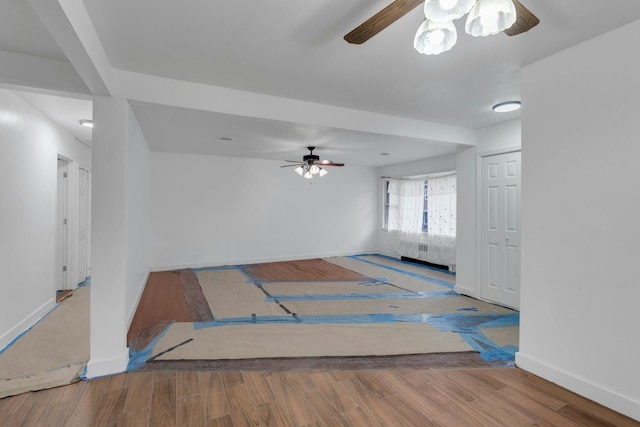 empty room featuring light hardwood / wood-style flooring and ceiling fan