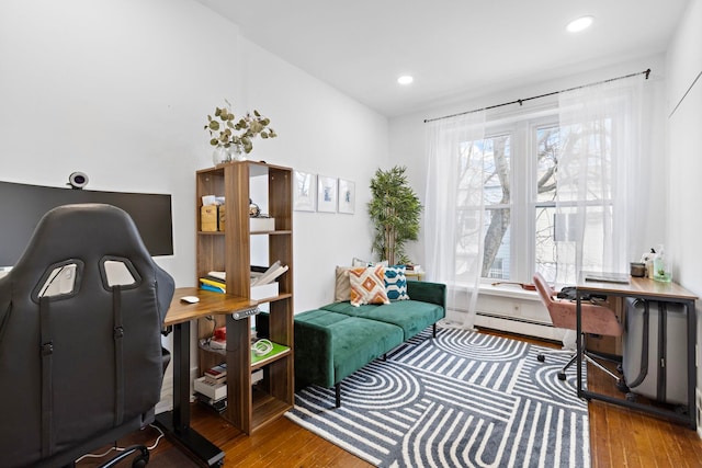 office featuring recessed lighting, baseboard heating, and hardwood / wood-style flooring