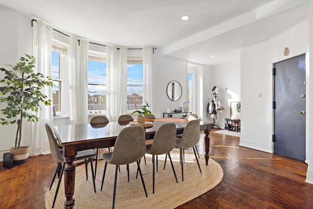 dining space featuring recessed lighting, baseboards, and hardwood / wood-style flooring