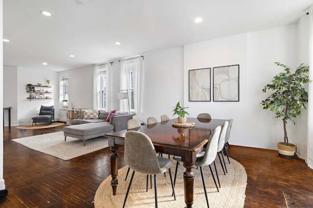 dining room with wood-type flooring and recessed lighting