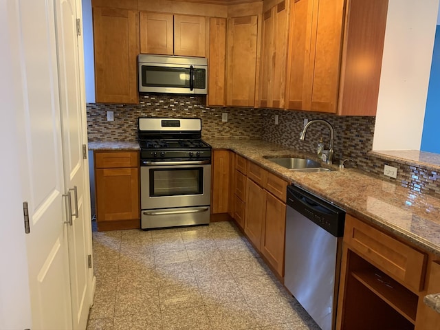 612 Palisade Ave, Jersey City, NJ 07307 - kitchen with stainless steel appliances, tasteful backsplash, granite finish floor, and a sink