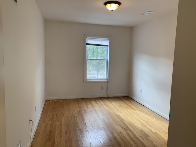 612 Palisade Ave, Jersey City, NJ 07307 - spare room featuring wood finished floors, baseboards, and visible vents