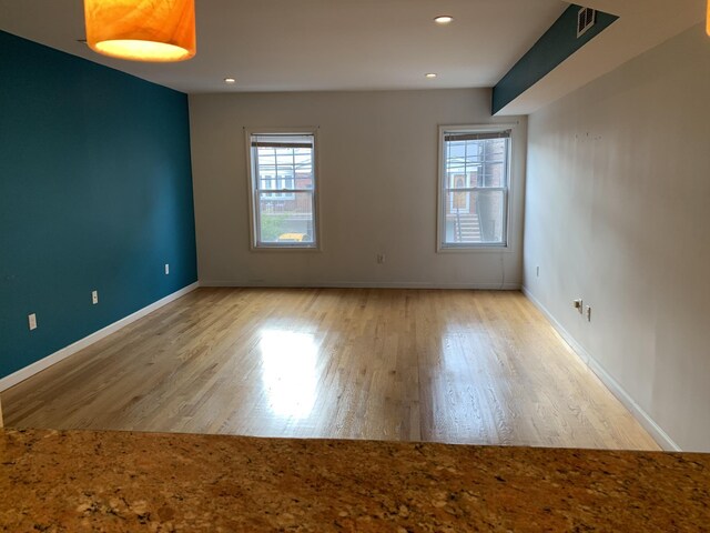 612 Palisade Ave, Jersey City, NJ 07307 - unfurnished room featuring visible vents, baseboards, recessed lighting, and wood finished floors
