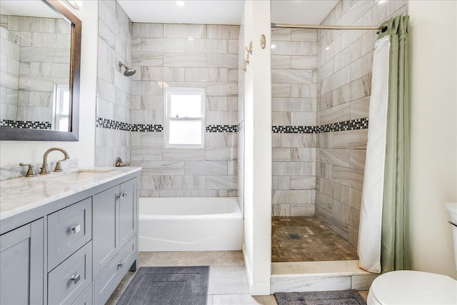 full bathroom with separate shower and tub, toilet, tile patterned flooring, and vanity