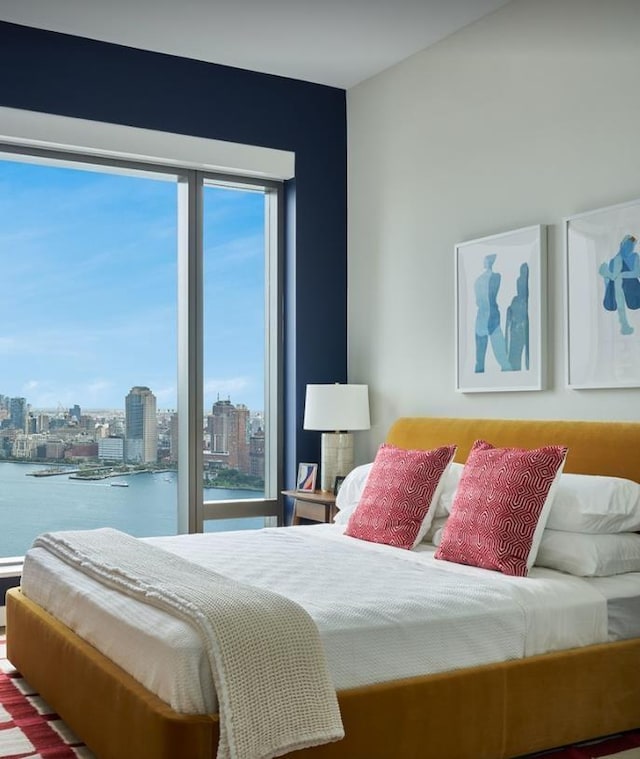 bedroom featuring a water view