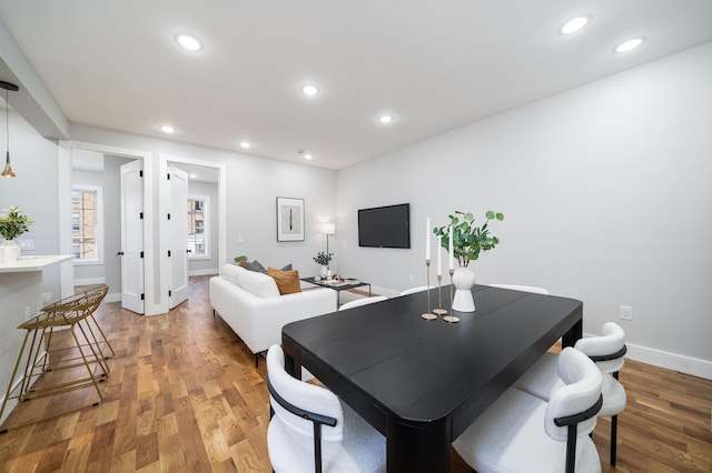 dining space featuring hardwood / wood-style floors