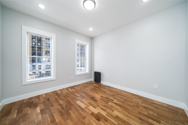 unfurnished room featuring hardwood / wood-style floors