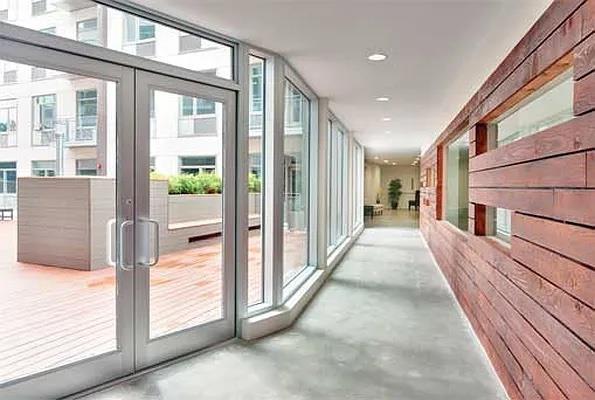 hall with dark hardwood / wood-style floors and electric panel