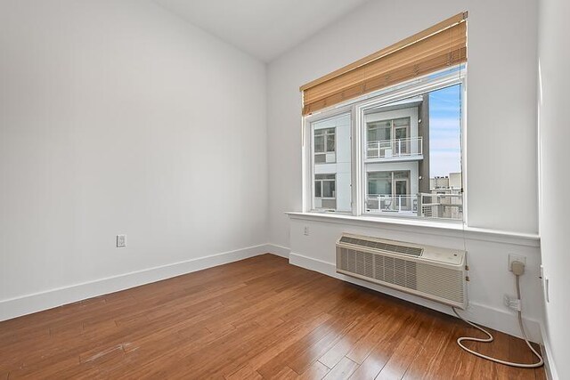 workout area featuring an AC wall unit