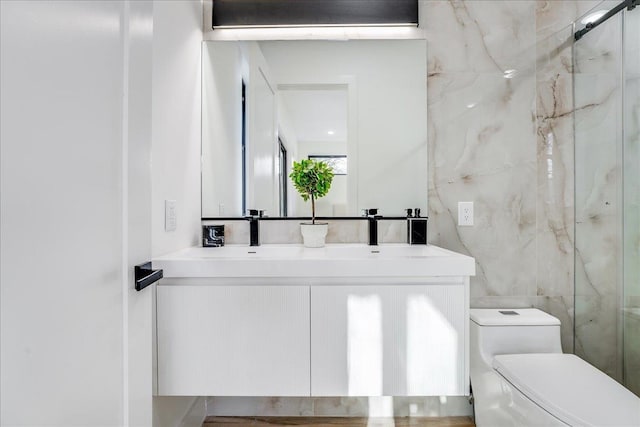 177 Wilkinson Ave Unit 1, Jersey City, NJ 07305 - full bathroom with tile walls, toilet, vanity, and a marble finish shower