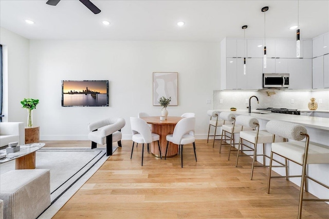177 Wilkinson Ave Unit 1, Jersey City, NJ 07305 - dining space with light wood-style floors, a ceiling fan, baseboards, and recessed lighting