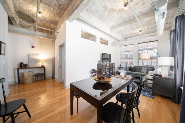 140 Bay St Unit 6E, Jersey City, NJ 07302 - dining area with light wood-style flooring and baseboards