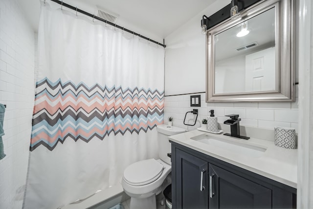 131 Iozia Ter, Elmwood Park, NJ 07407 - bathroom with curtained shower, visible vents, toilet, vanity, and tile walls