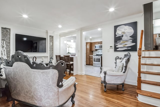 131 Iozia Ter, Elmwood Park, NJ 07407 - living room with light wood-type flooring, recessed lighting, and ornamental molding