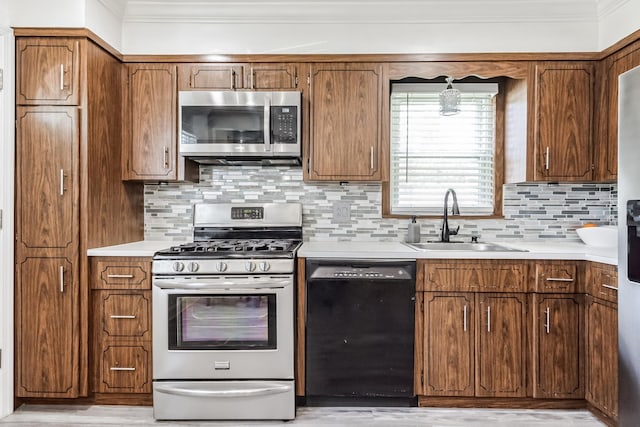 131 Iozia Ter, Elmwood Park, NJ 07407 - kitchen with brown cabinets, tasteful backsplash, stainless steel appliances, and a sink
