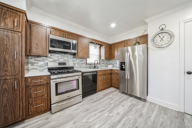 131 Iozia Ter, Elmwood Park, NJ 07407 - kitchen featuring light countertops, a sink, light wood-style floors, and appliances with stainless steel finishes