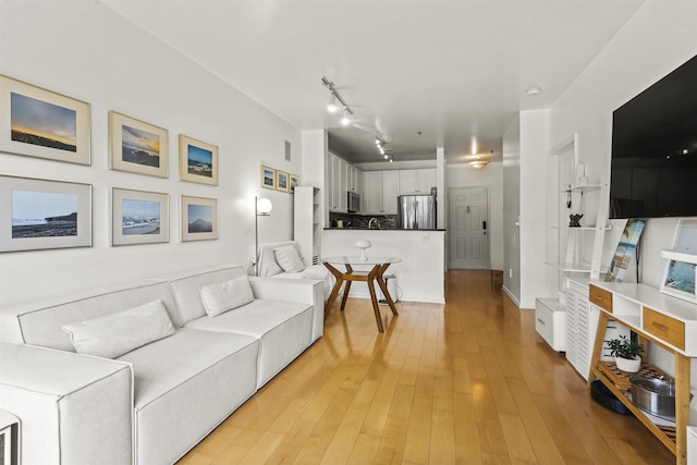 24 Ave At Port Imperial Unit 328, West New York, NJ 07093 - living room featuring light wood-style flooring and track lighting