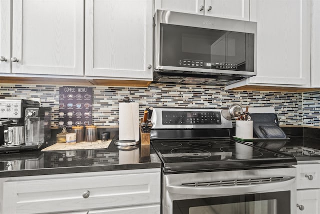 24 Ave At Port Imperial Unit 328, West New York, NJ 07093 - kitchen with stainless steel appliances, dark countertops, and white cabinetry