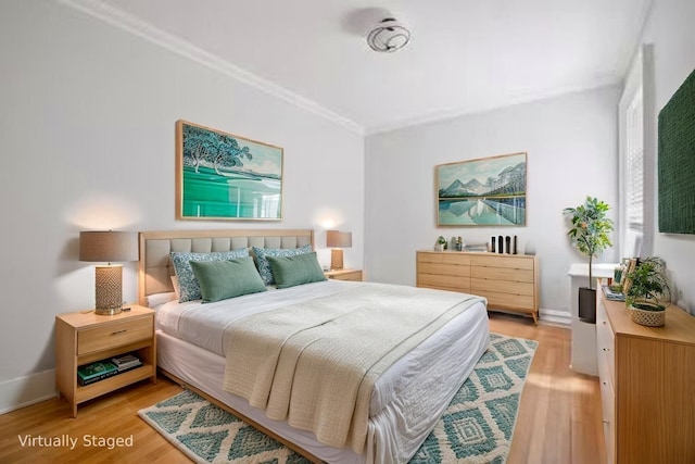 1000 Hudson St Unit 209, Hoboken, NJ 07030 - bedroom featuring crown molding and light wood finished floors
