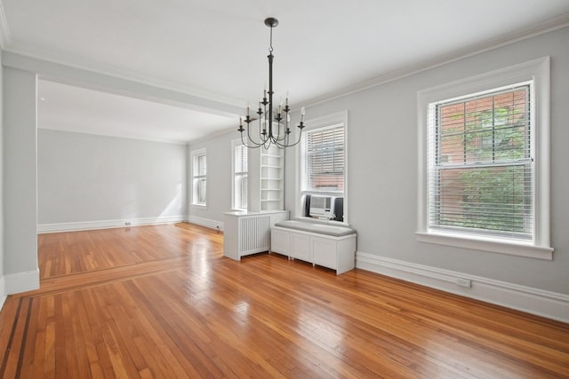 1000 Hudson St Unit 209, Hoboken, NJ 07030 - unfurnished dining area with crown molding, a chandelier, light wood-style floors, radiator heating unit, and cooling unit