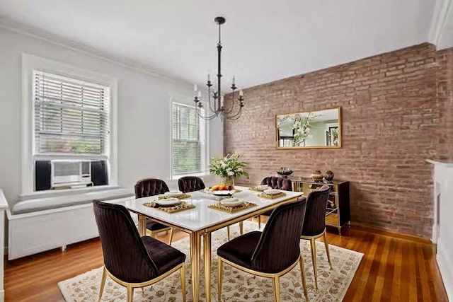 1000 Hudson St Unit 209, Hoboken, NJ 07030 - dining space featuring brick wall, a chandelier, wood finished floors, and cooling unit