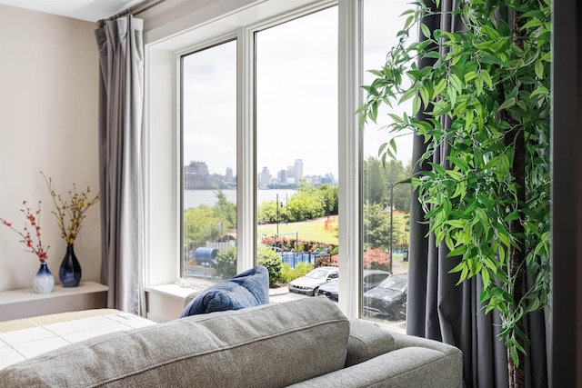 150 Henley Pl Unit 202, Weehawken, NJ 07086 - bedroom featuring multiple windows, a city view, and a water view